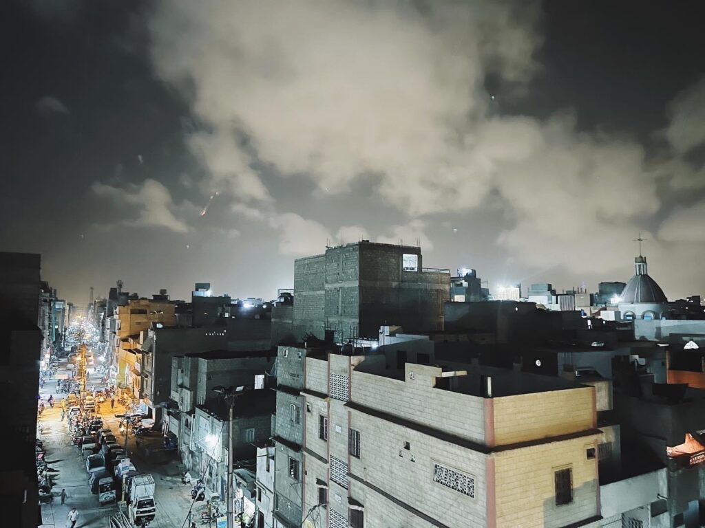 Night view of Pakistani buildings and street, showcasing a nation with huge but different blessings