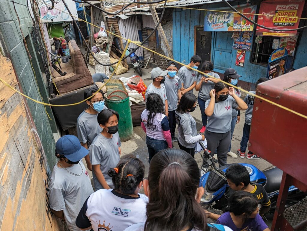 Faith in action: ASOFE youth on outreach to Guatemalan families living in garbage dumps.