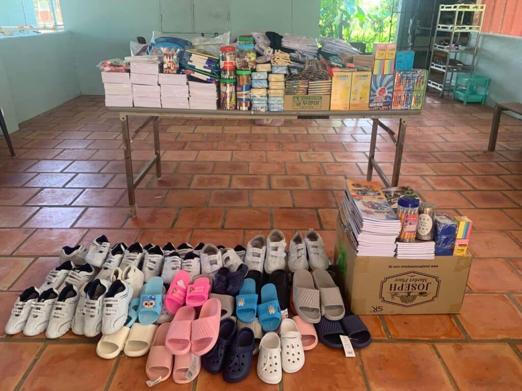 Removing the 'grave clothes' of the previous generation in Cambodia, and taking on new clothing from God in the form of study materials, sandals, and other supplies pictured here.